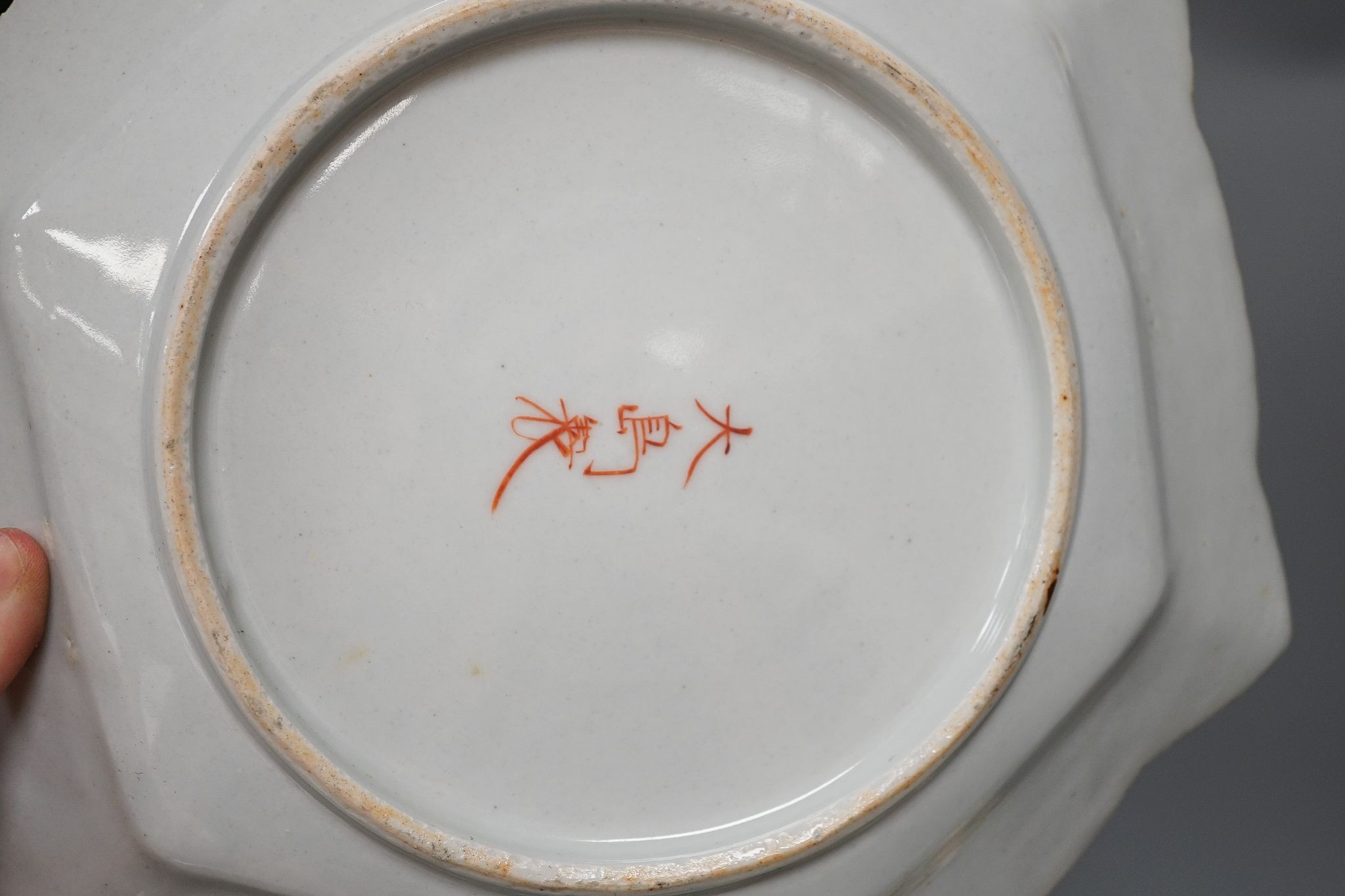 Three late 19th century Japanese porcelain dishes and a jardiniere, 19 cms high.